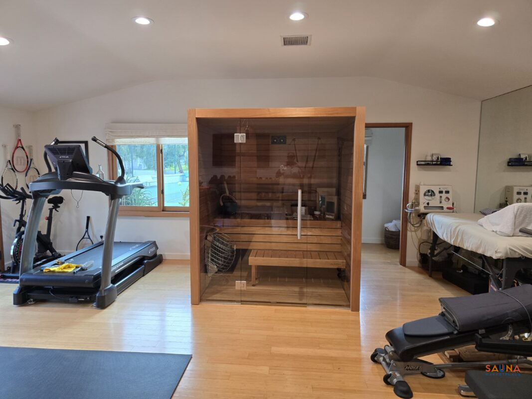 A Cala Glass with two glass panels and a center door in a home gym.